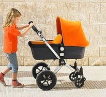 649-01556937em-young-girl-57-pushing-buggy-on-pavement-while-mother-talks-on-mobile.jpg