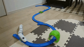 toy-train-derails-then-uses-a-wall-to-go-back-on-the-track.gif