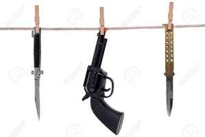 2110396-knifes-and-toy-gun-hanging-on-a-clothesline-isolated-on-a-white-background.jpg
