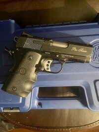 Smith & Wesson Pro Series SUBCOMPACT 45 ACP 1911. Left on case.jpg